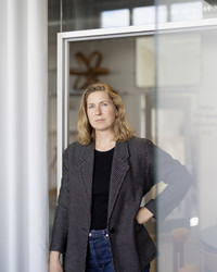 Ane Pilegaard standing in doorway.