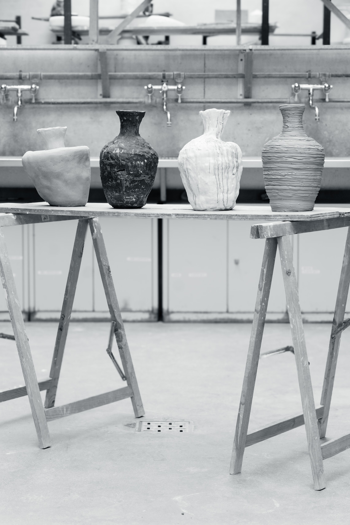 our ceramic vases on a table in a workshop.