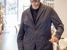Nicholas Rhodes standing by workdesk