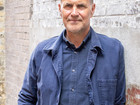 Nicolai de Gier in front of grey wall