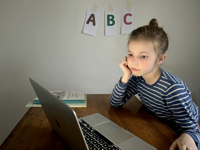 Little girl in front of computer