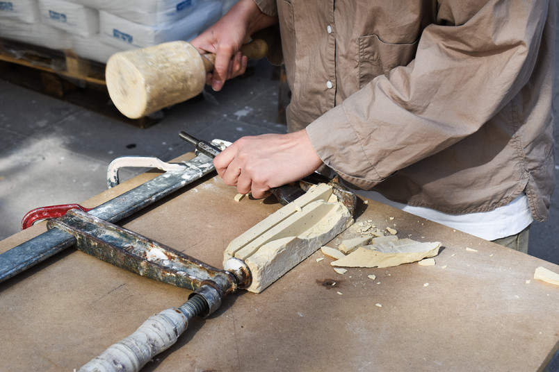 Stonemason breaking technique.