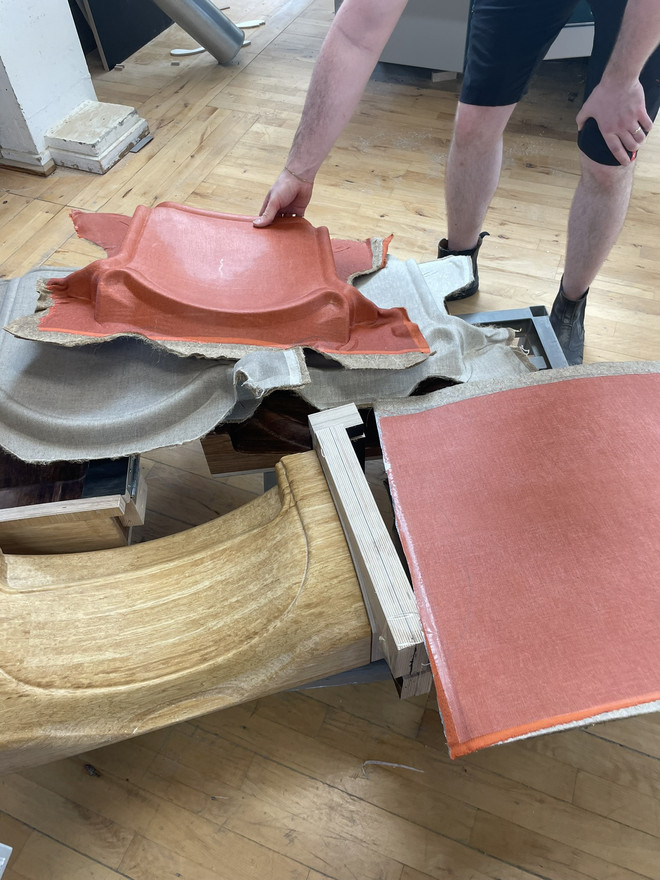 Pressed parts ready to be cut to final shape