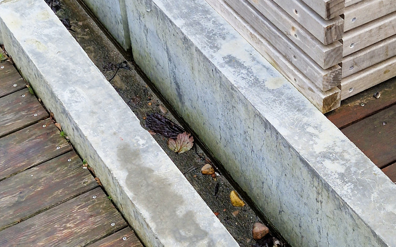 Detail of the trench running through the wooden pathway
