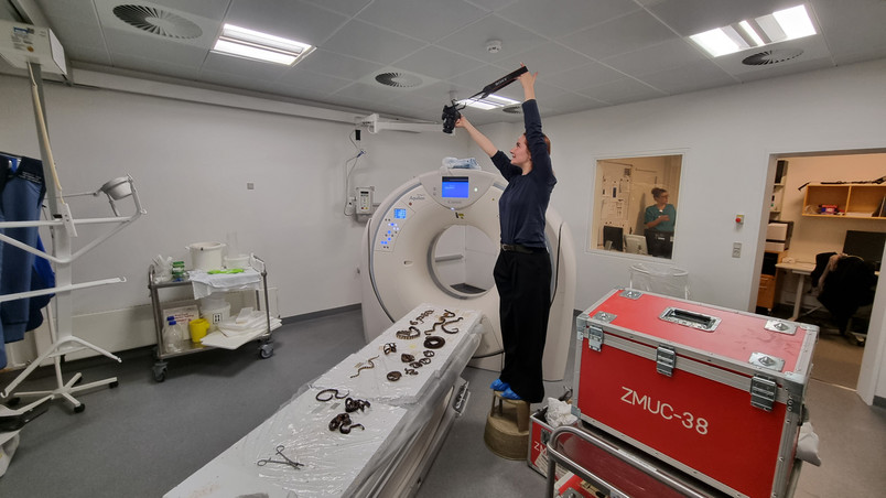 Me at the CT-scan session photographing the specimens placement on the patient table
