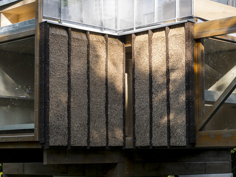 Close-up of architecture facade with thatched elements 