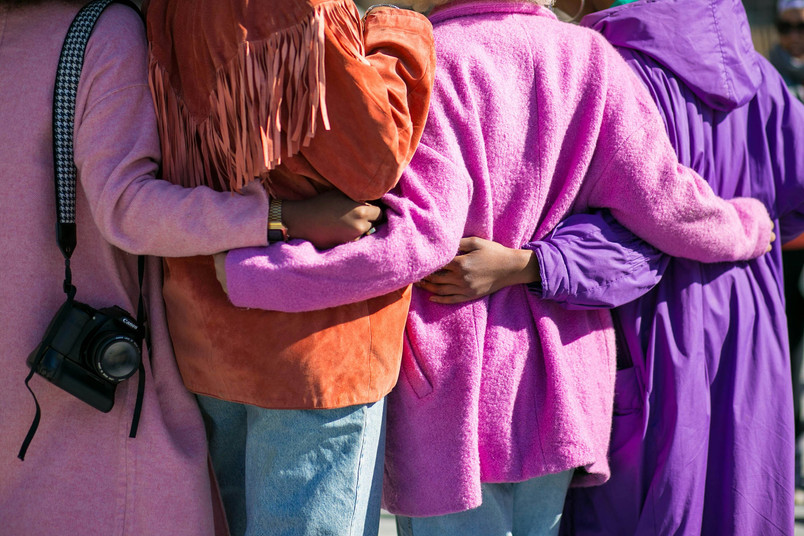 Group of people hugging.