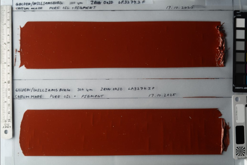 Two samples of reddish-brown iron oxide paint on a white background, with handwritten annotations and measurement scales.