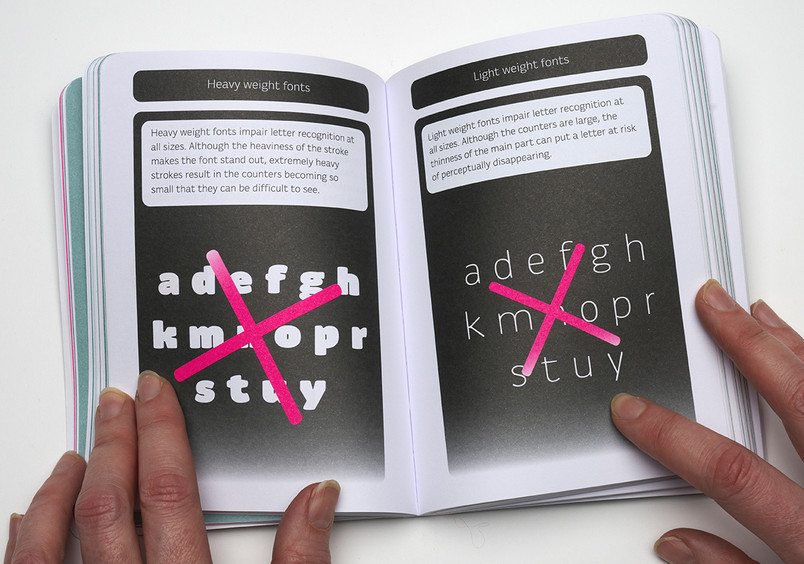 Hands on open book with crossed over letters