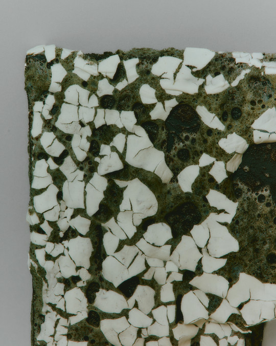 detail of the glaze, white crawling on a dark crater