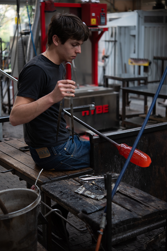 Dimitri Sarazin on the glass blowing bench