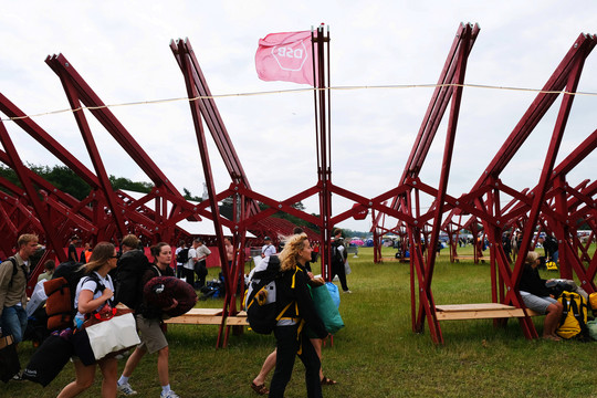 Red wooden station structure on a lawn