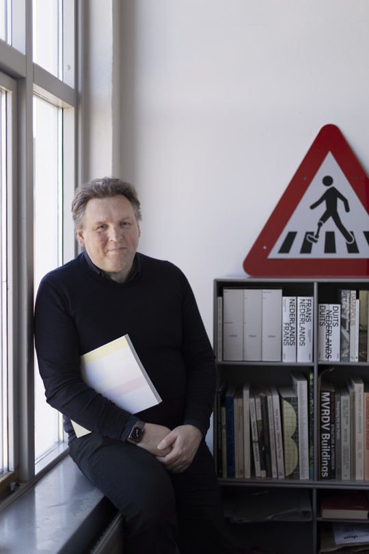 Portrait photograph of Joost Grootens in his office at the Royal Danish Academy