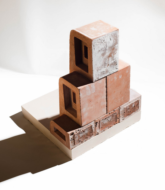 The 1:1 model of the brick tile system - back side with visible marks of geopolymer casting