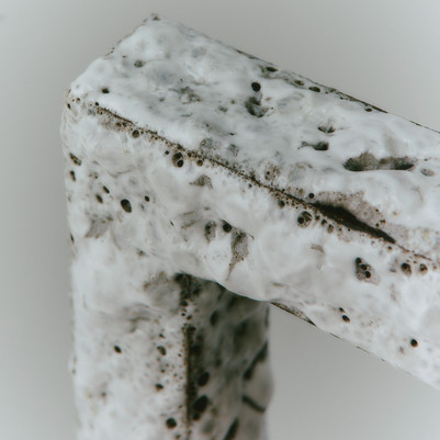 detail of white bubbly glaze, rectangular frame 