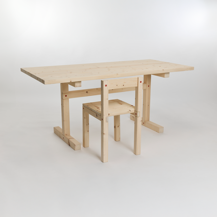 A light wooden table and chair set made from reclaimed pine, photographed against a plain white background.