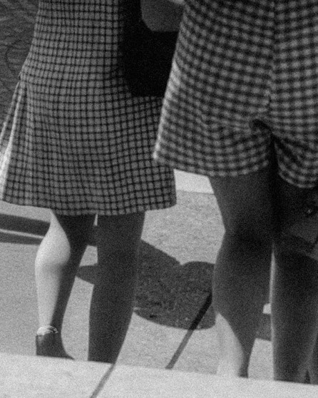 Two girls walking down stairs