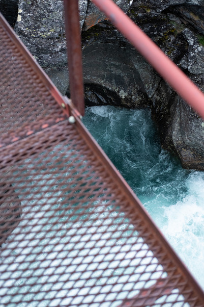 Close up photograph of a steel bridge over gorge in northern Sweden