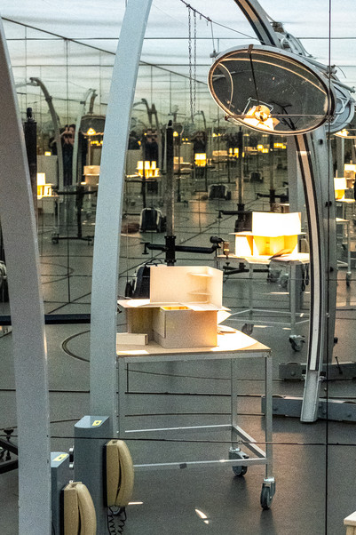 A sketch model standing on a table in the daylight lab, a mirror room with an artificial sun.