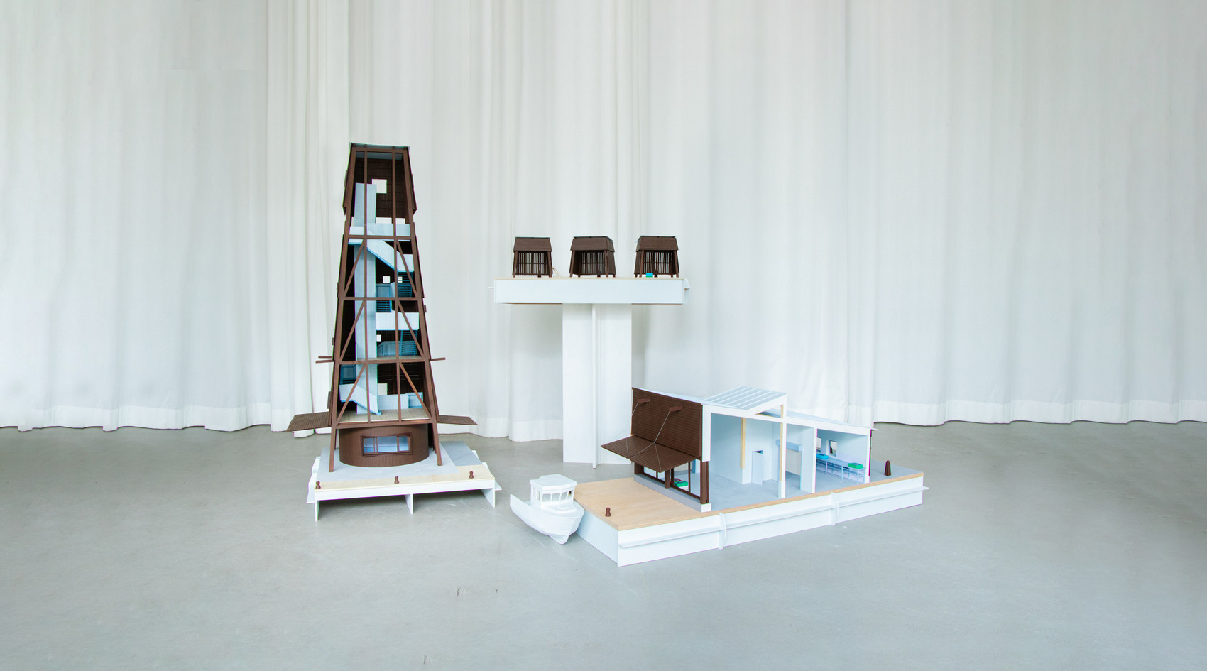 Photo of models showing the different family members, Båken, Lotshuset, Bodarna and Vakarna 